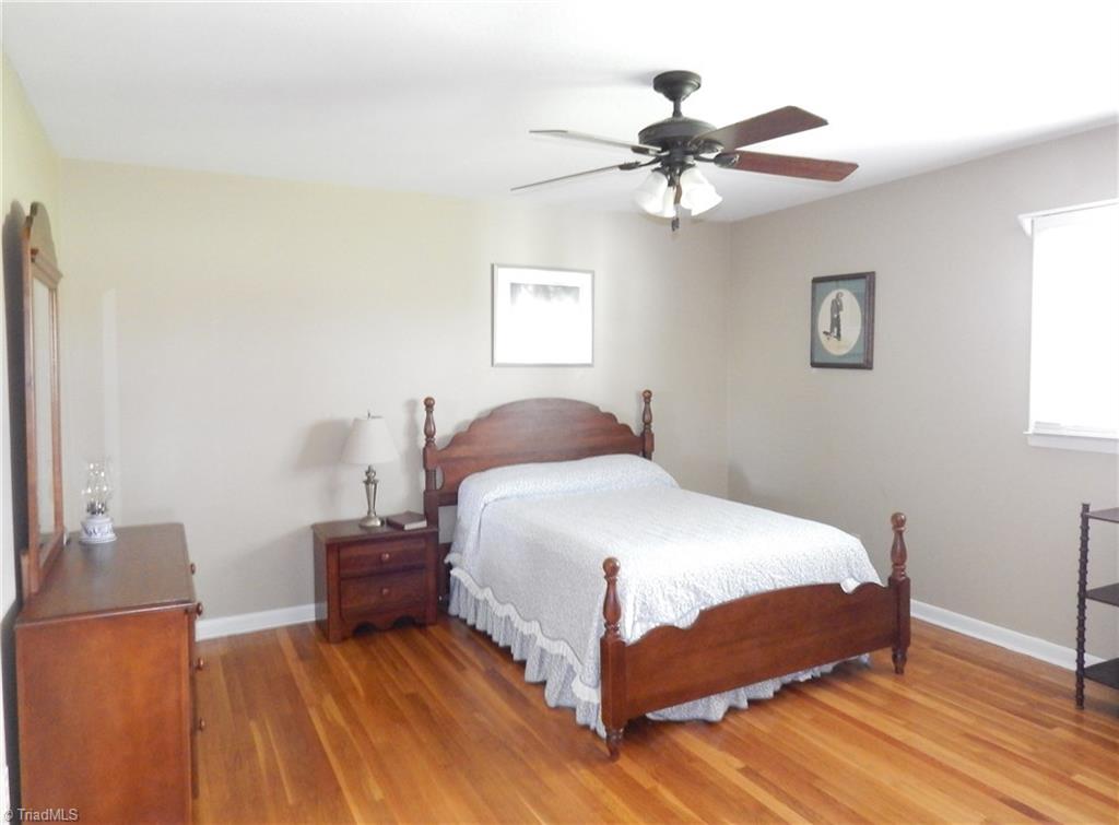 2103 Collinstown Road Westfield, NC 27053 - Photo 13 of 30 The second bedroom has original hardwood flooring and offers a lot of floor space for your furniture!