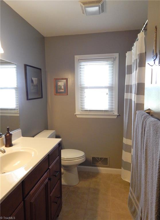 2103 Collinstown Road Westfield, NC 27053 - Photo 14 of 30 Pretty hall bath with updated vanity and tile flooring!