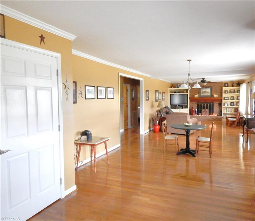 2103 Collinstown Road Westfield, NC 27053 - Photo 30 of 30 Open floor plan, gleaming hardwood flooring, crown molding, plus that is a pantry to your left! The pantry was added when seller gutted the whole front section of the home, shortly after purchasing!