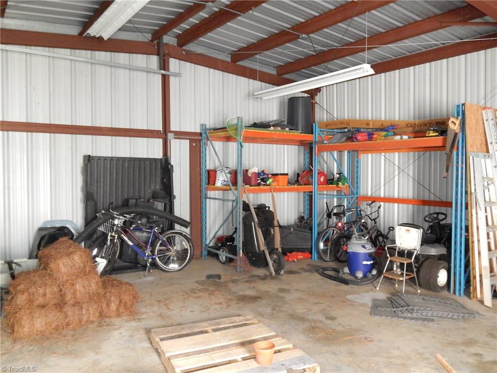 2103 Collinstown Road Westfield, NC 27053 - Photo 26 of 30 Inside metal garage has a lot of floor space for a workshop or man cave!! Shelving does not convey!