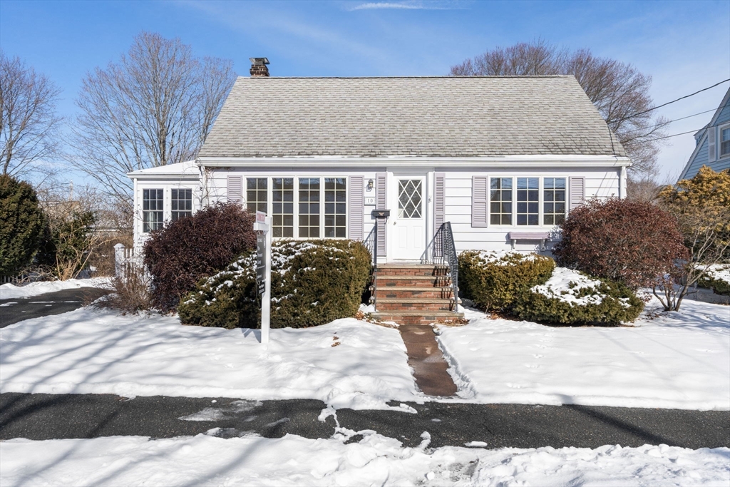a view of house with yard and sitting space
