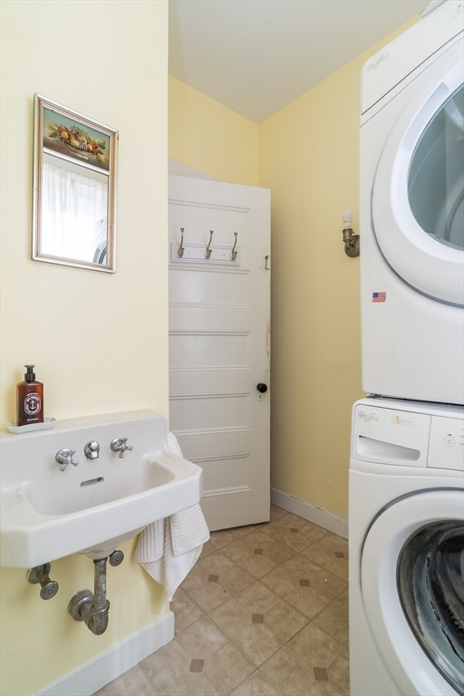224 Bacon Street Natick, MA 01760 - Photo 15 of 28 a utility room with sink dryer and washer