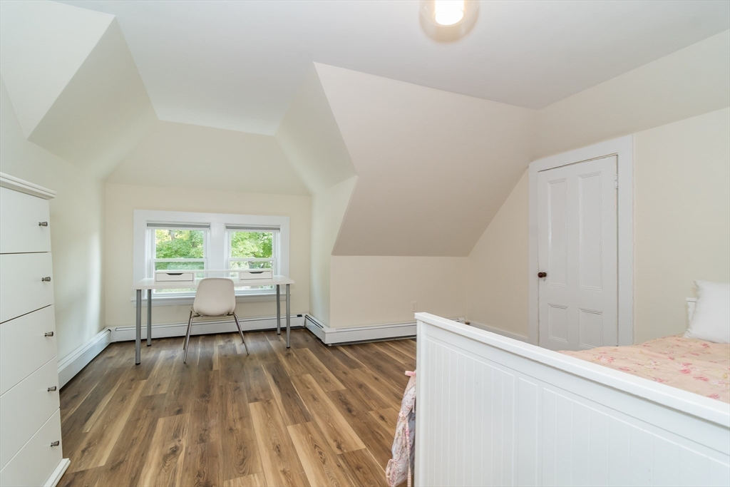 224 Bacon Street Natick, MA 01760 - Photo 21 of 28 a living room with furniture and a wooden floor
