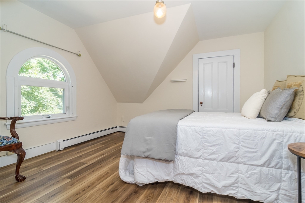 224 Bacon Street Natick, MA 01760 - Photo 23 of 28 a bedroom with a bed and window