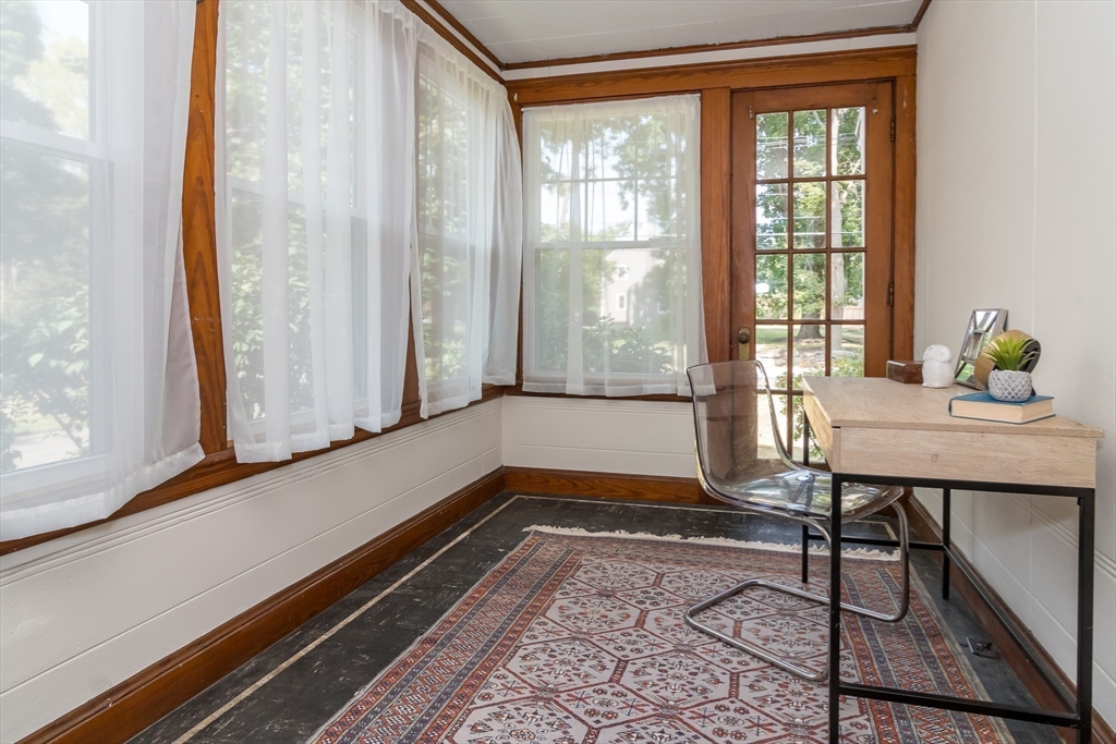 224 Bacon Street Natick, MA 01760 - Photo 25 of 28 a living room with a table and a window