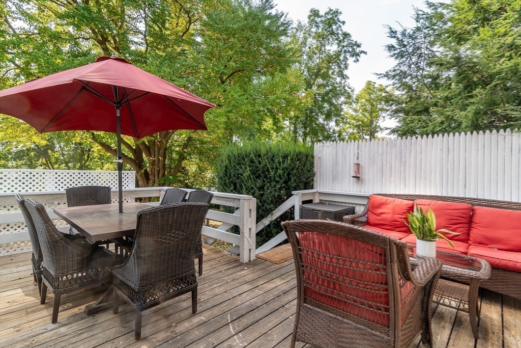224 Bacon Street Natick, MA 01760 - Photo 26 of 28 a view of backyard with outdoor seating and trees