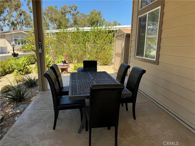 a view of a dining room with furniture and window