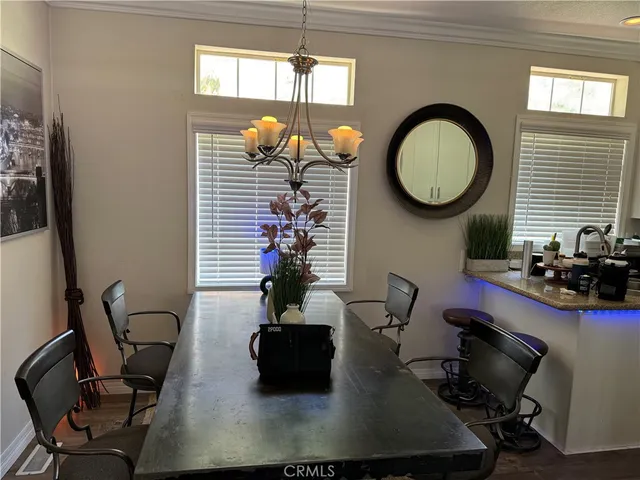 a living room with furniture a window and potted plant