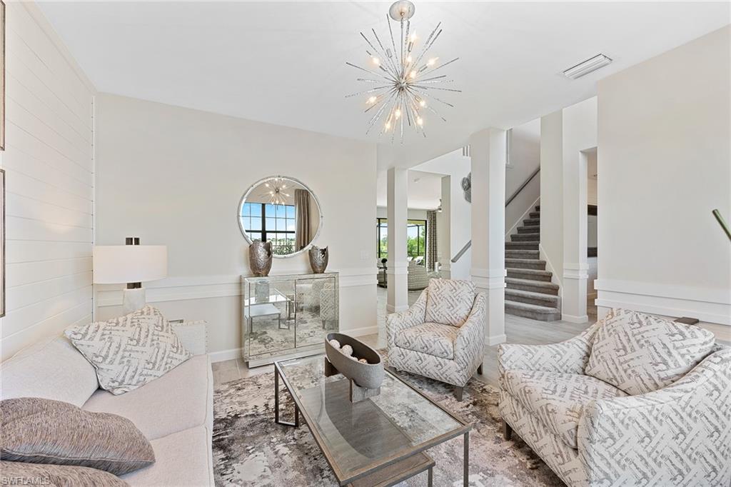 11581 Timber Creek Drive Fort Myers, FL 33913 - Photo 11 of 50 a living room with furniture and wooden floor