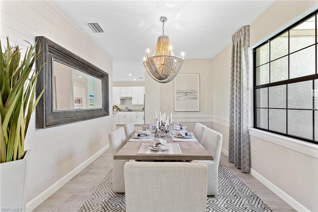 11581 Timber Creek Drive Fort Myers, FL 33913 - Photo 18 of 50 a dining room with furniture and a mirror