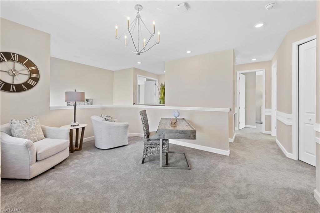 11581 Timber Creek Drive Fort Myers, FL 33913 - Photo 20 of 50 a living room with furniture and a chandelier