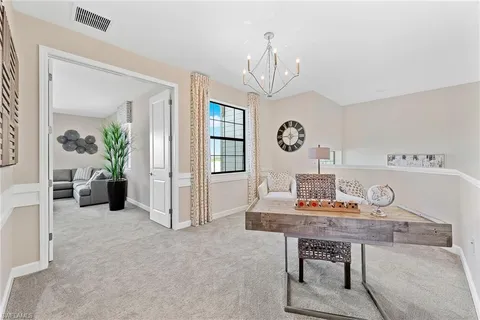 a view of a livingroom with furniture and windows