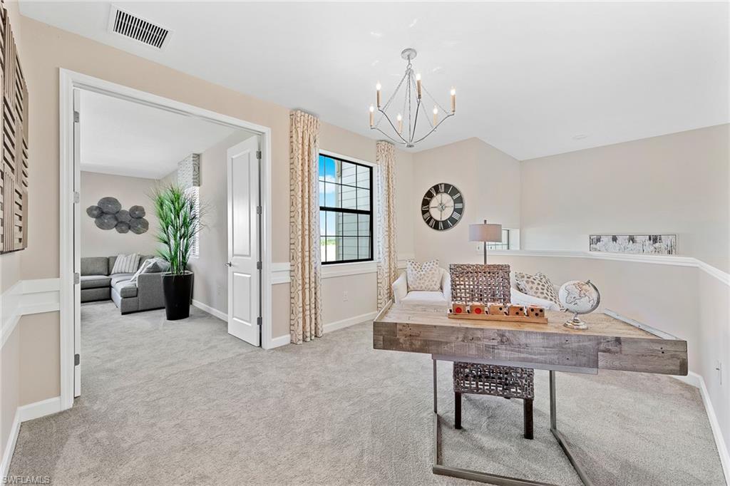 11581 Timber Creek Drive Fort Myers, FL 33913 - Photo 22 of 50 a view of a livingroom with furniture a chandelier and wooden floor