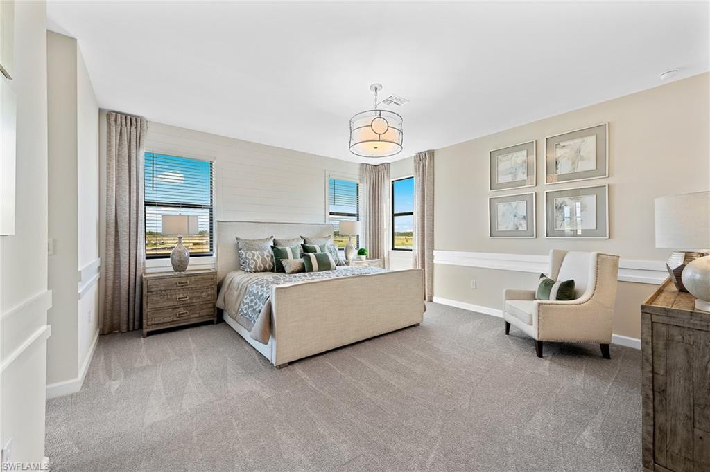 11581 Timber Creek Drive Fort Myers, FL 33913 - Photo 23 of 50 a living room with furniture and a chandelier