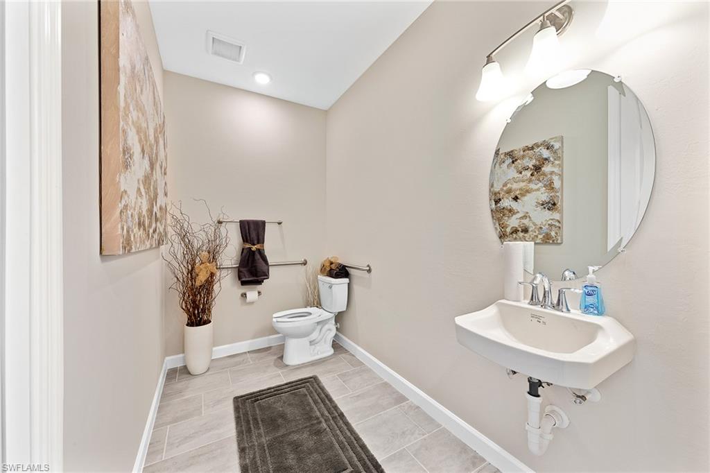 11581 Timber Creek Drive Fort Myers, FL 33913 - Photo 27 of 50 a bathroom with a sink toilet and a mirror
