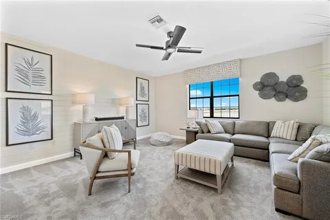 a bedroom with two beds and a chandelier