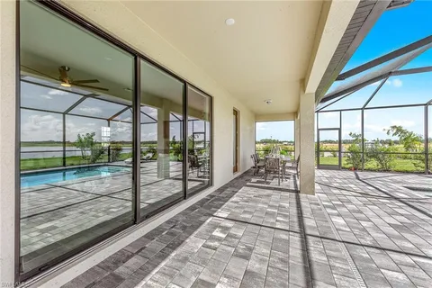a view of swimming pool with outdoor seating