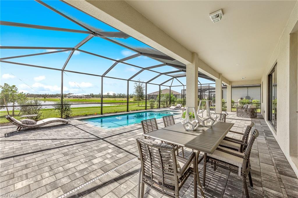 11581 Timber Creek Drive Fort Myers, FL 33913 - Photo 40 of 50 a view of a patio with a table and chairs