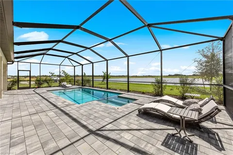 a view of a patio with a table and chairs