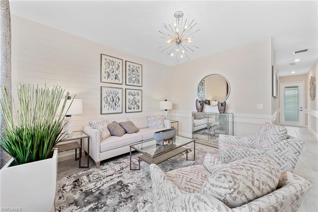 11581 Timber Creek Drive Fort Myers, FL 33913 - Photo 8 of 50 a living room with furniture and a chandelier