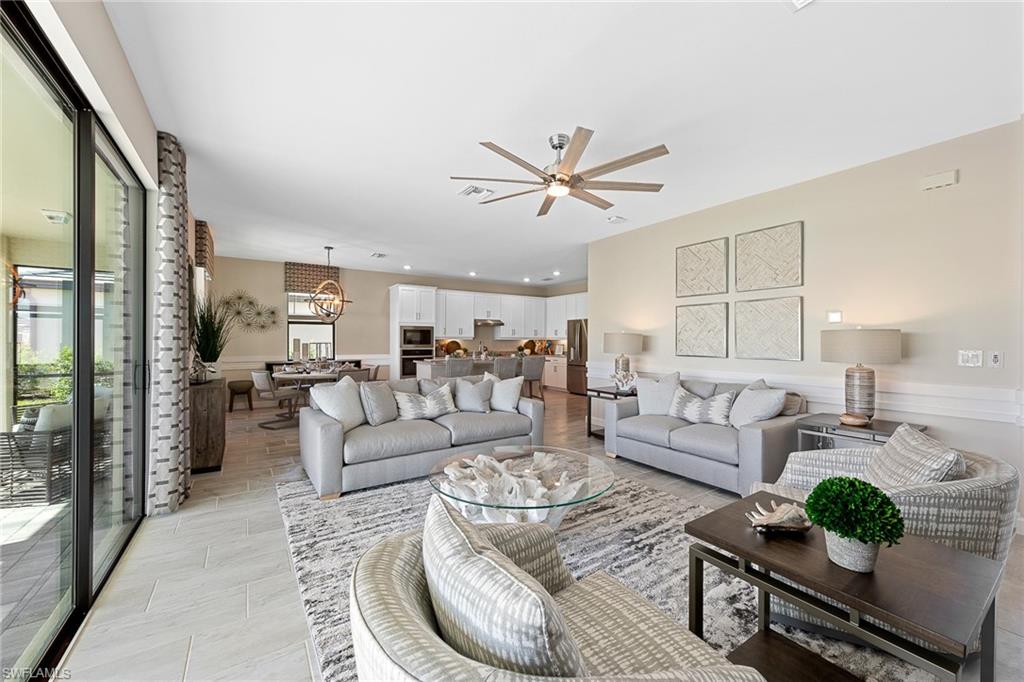 11581 Timber Creek Drive Fort Myers, FL 33913 - Photo 9 of 50 a living room with furniture and a large window