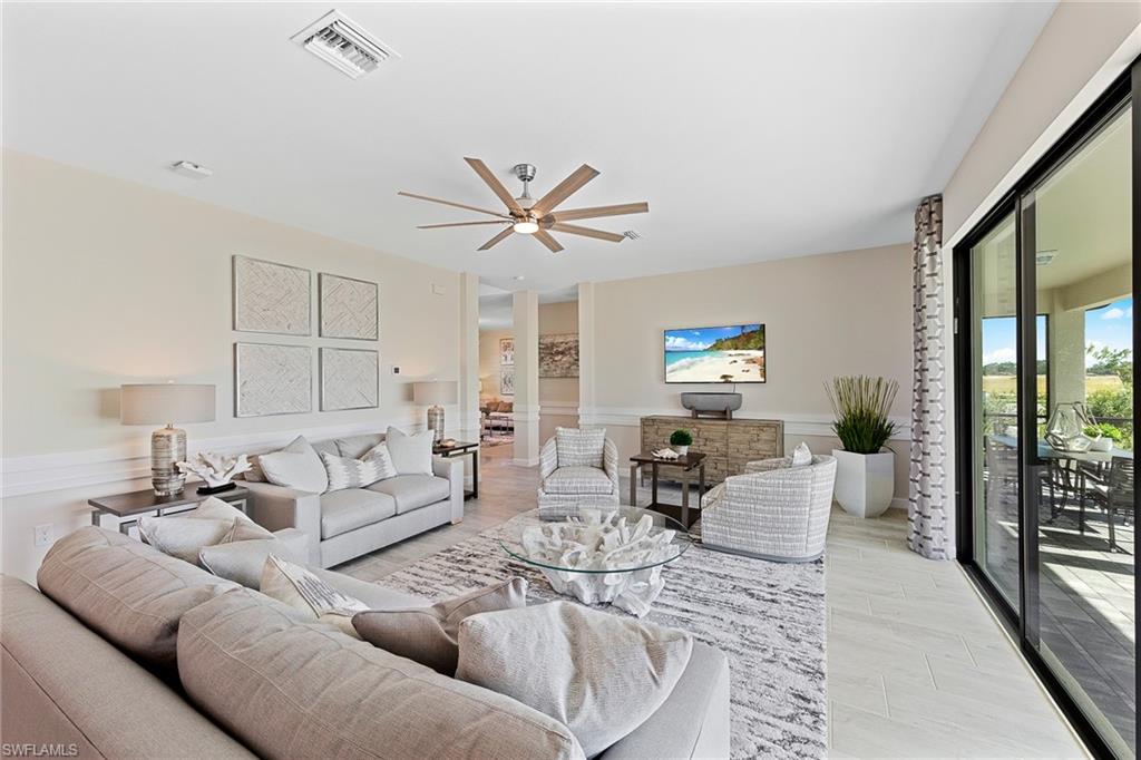 11581 Timber Creek Drive Fort Myers, FL 33913 - Photo 10 of 50 a living room with furniture and a large window