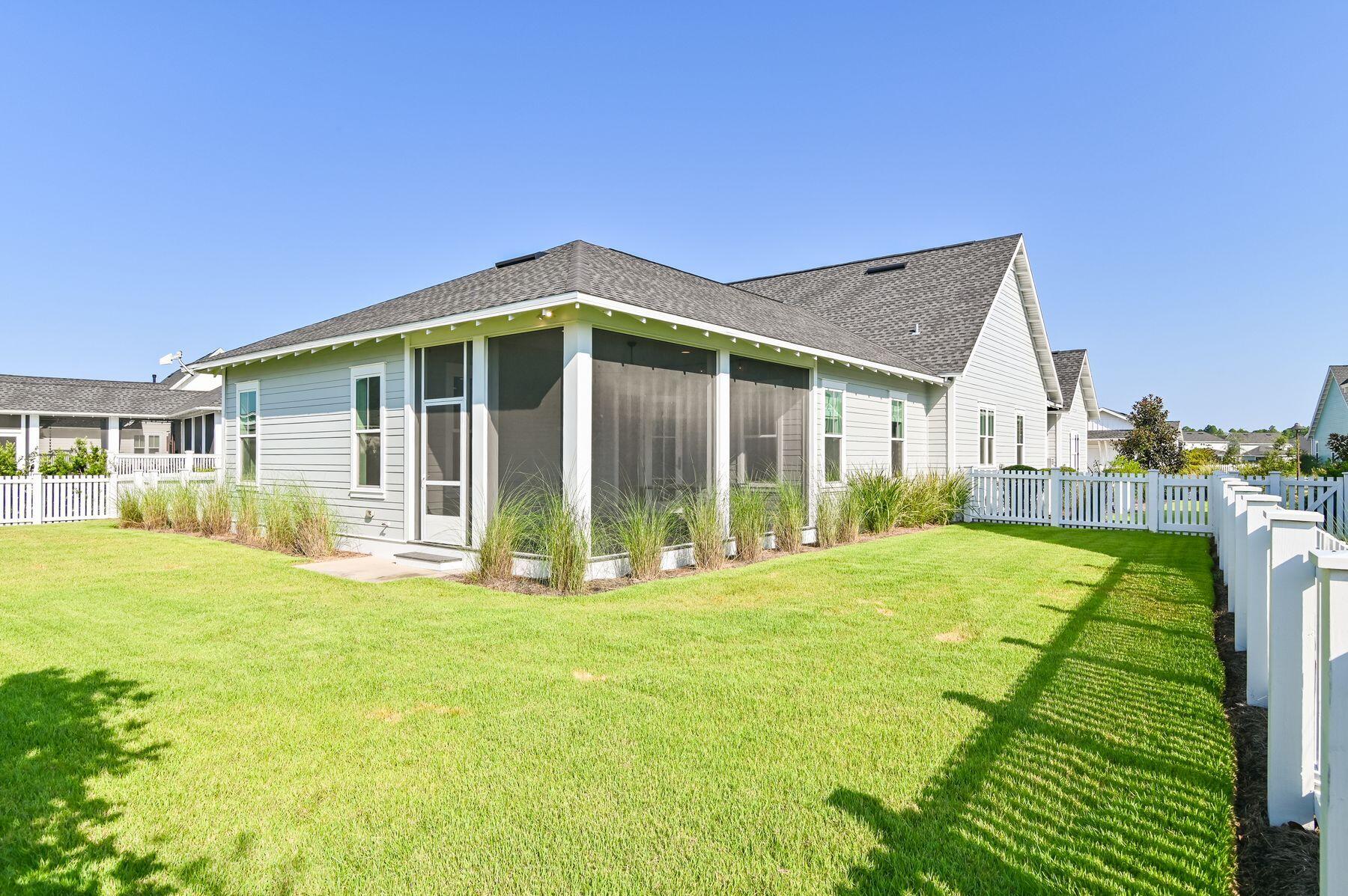 82 Sidecamp Road Watersound, FL 32461 - Photo 13 of 32 a view of a house with yard and deck