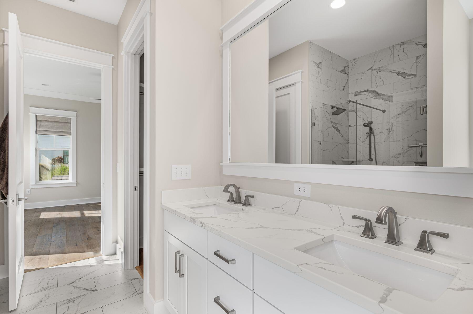 82 Sidecamp Road Watersound, FL 32461 - Photo 15 of 32 a bathroom with double vanity sink and a mirror