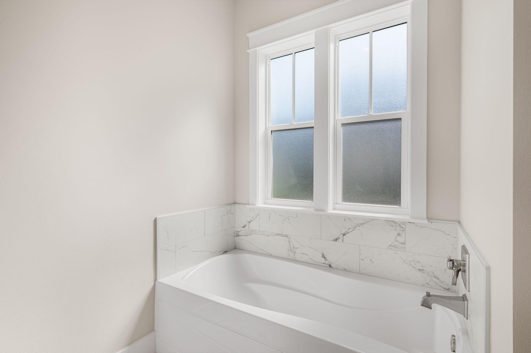 82 Sidecamp Road Watersound, FL 32461 - Photo 16 of 32 a bathroom with a bathtub