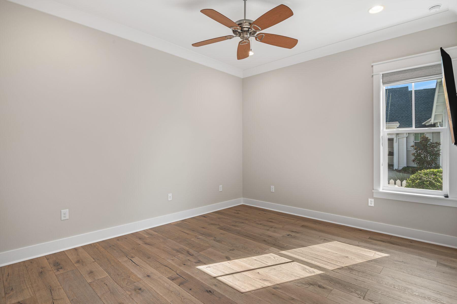 82 Sidecamp Road Watersound, FL 32461 - Photo 18 of 32 an empty room with a window and a fan