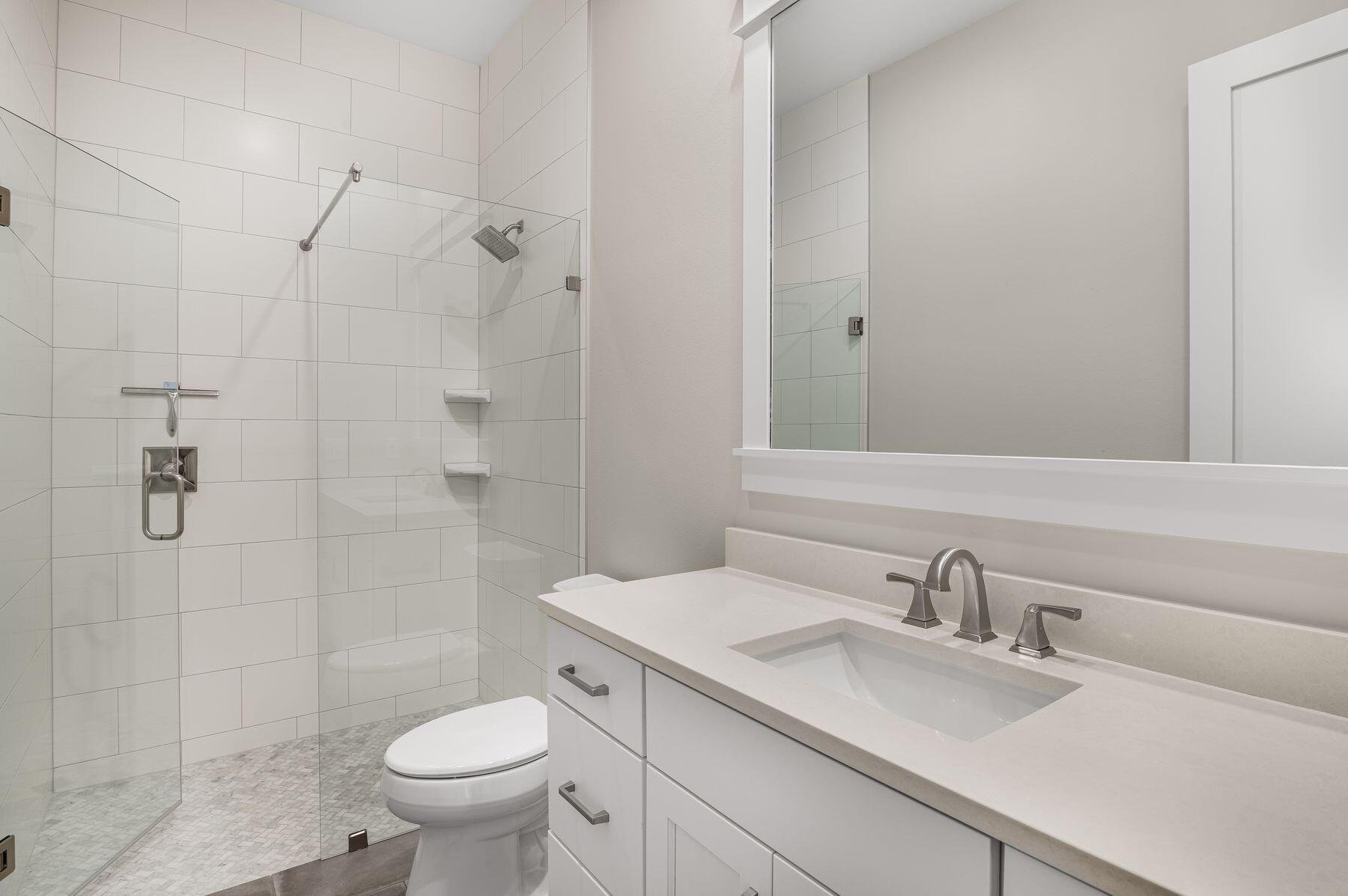 82 Sidecamp Road Watersound, FL 32461 - Photo 20 of 32 a bathroom with a sink toilet and shower