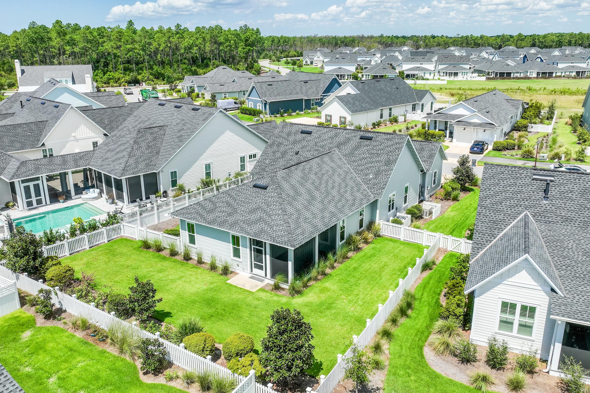 82 Sidecamp Road Watersound, FL 32461 - Photo 2 of 32 an aerial view of residential houses with yard and ocean view