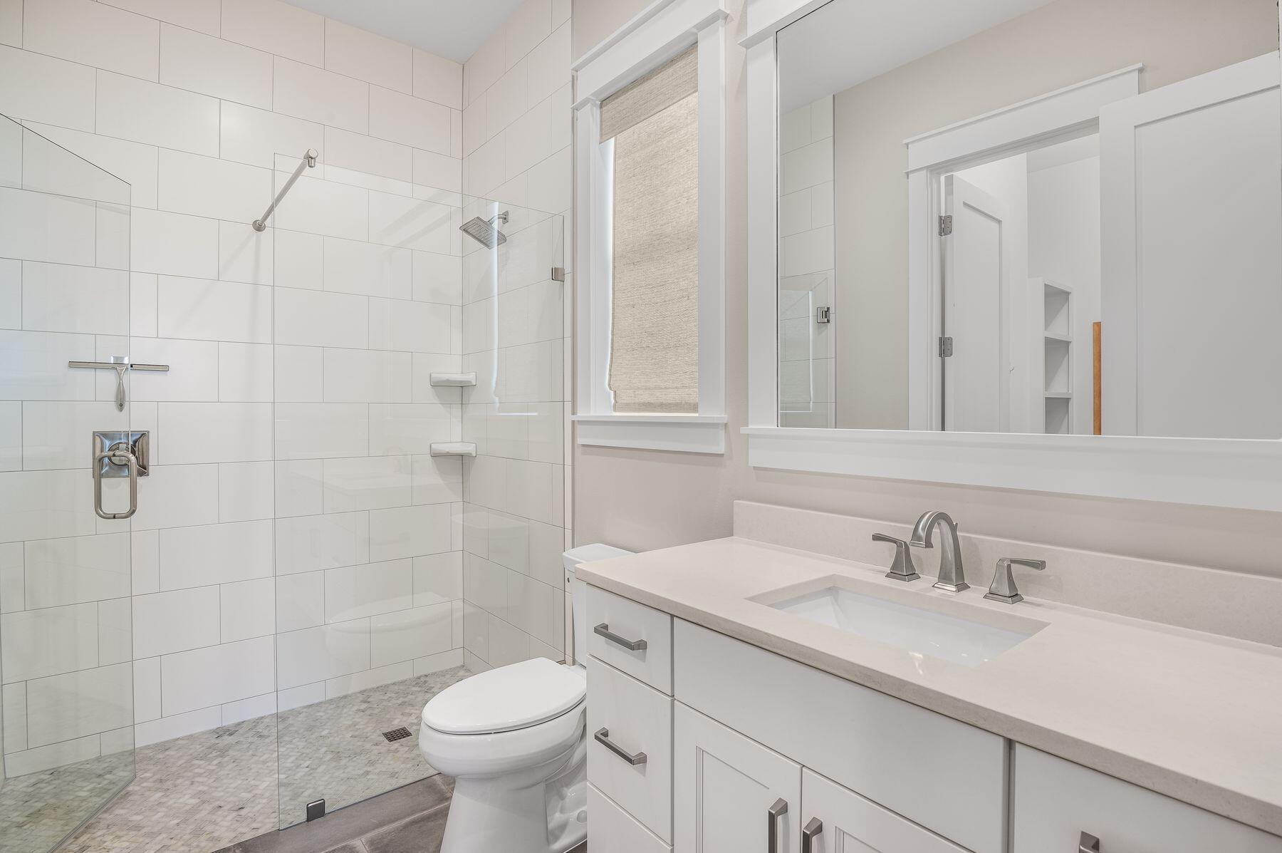 82 Sidecamp Road Watersound, FL 32461 - Photo 23 of 32 a bathroom with a sink toilet and shower