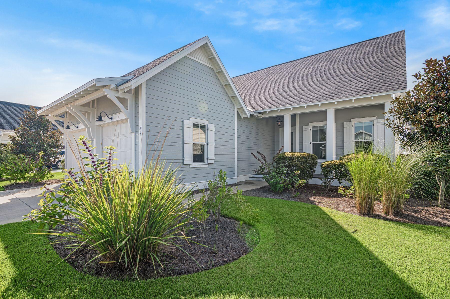 82 Sidecamp Road Watersound, FL 32461 - Photo 25 of 32 a front view of house with a garden