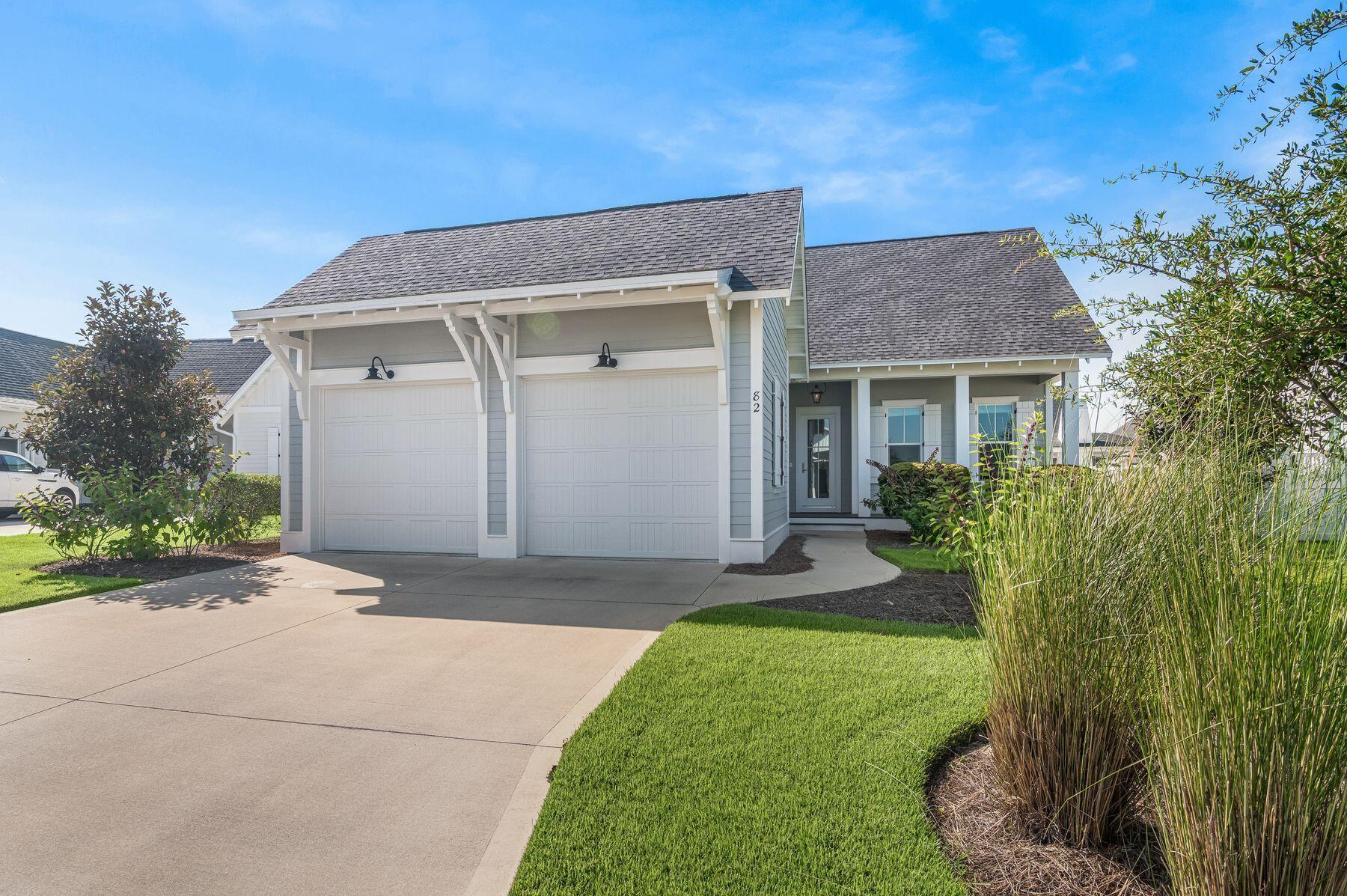82 Sidecamp Road Watersound, FL 32461 - Photo 26 of 32 a view of a house with a yard