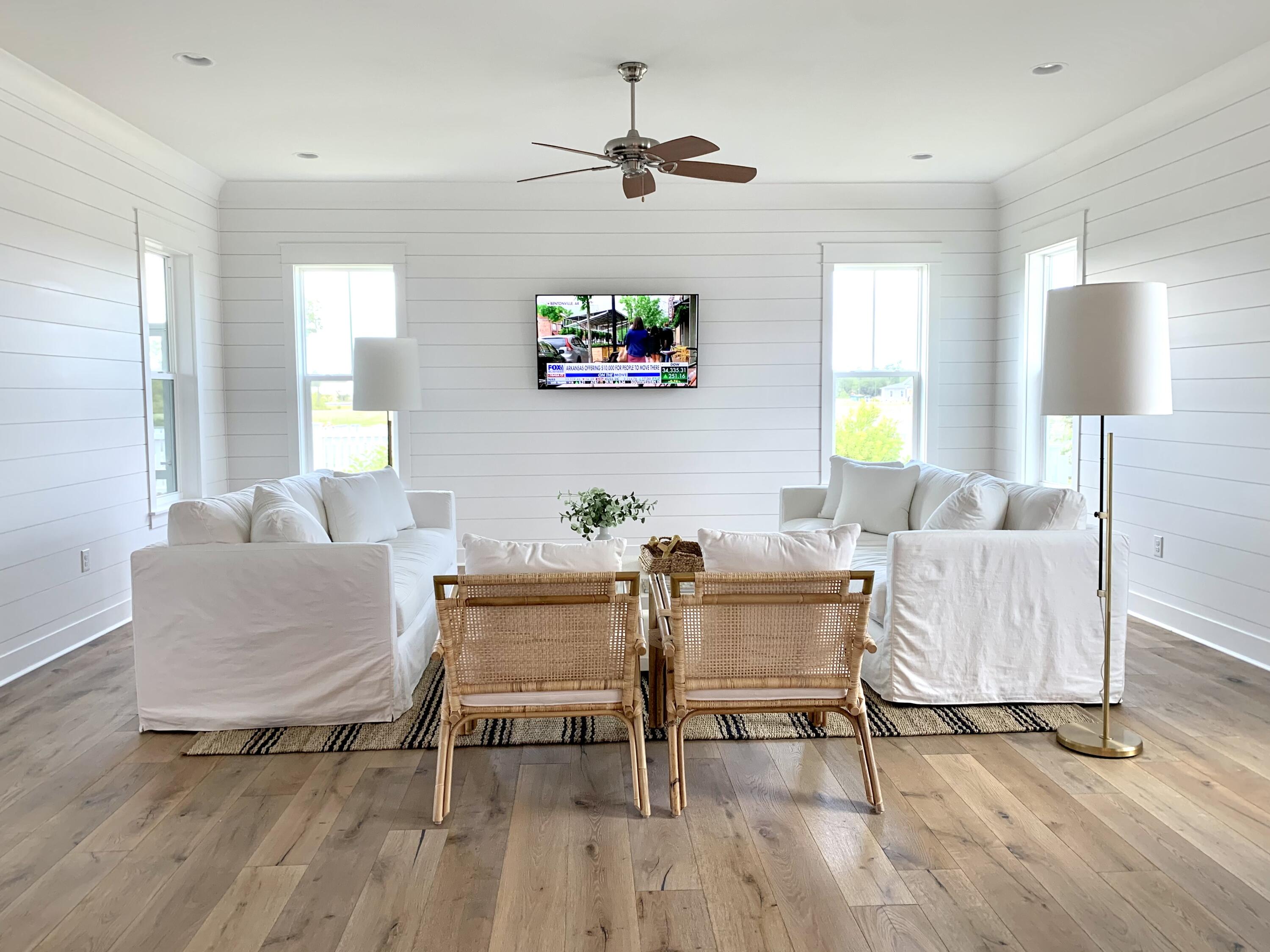 82 Sidecamp Road Watersound, FL 32461 - Photo 27 of 32 a living room with furniture and a wooden floor