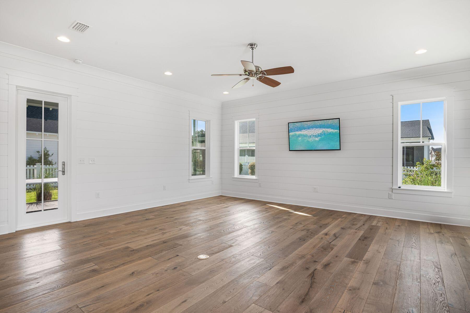 82 Sidecamp Road Watersound, FL 32461 - Photo 7 of 32 a view of empty room with wooden floor and fan
