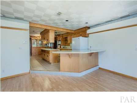 150 Balboa Road Cantonment, FL 32533 - Photo 12 of 25 The Den, looking into the Kitchen