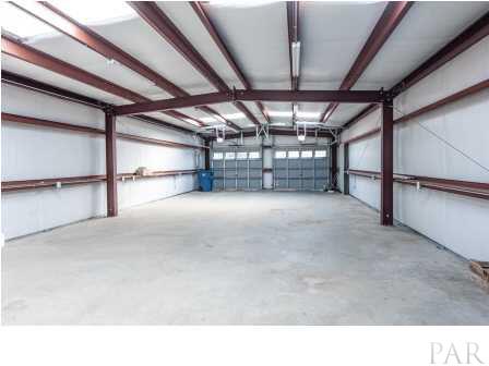 150 Balboa Road Cantonment, FL 32533 - Photo 23 of 25 Another view of the storage building, already has garage openers installed