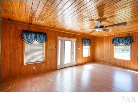 150 Balboa Road Cantonment, FL 32533 - Photo 4 of 25 Walk into this Foyer, the natural light in this home shows off the hardwood floors