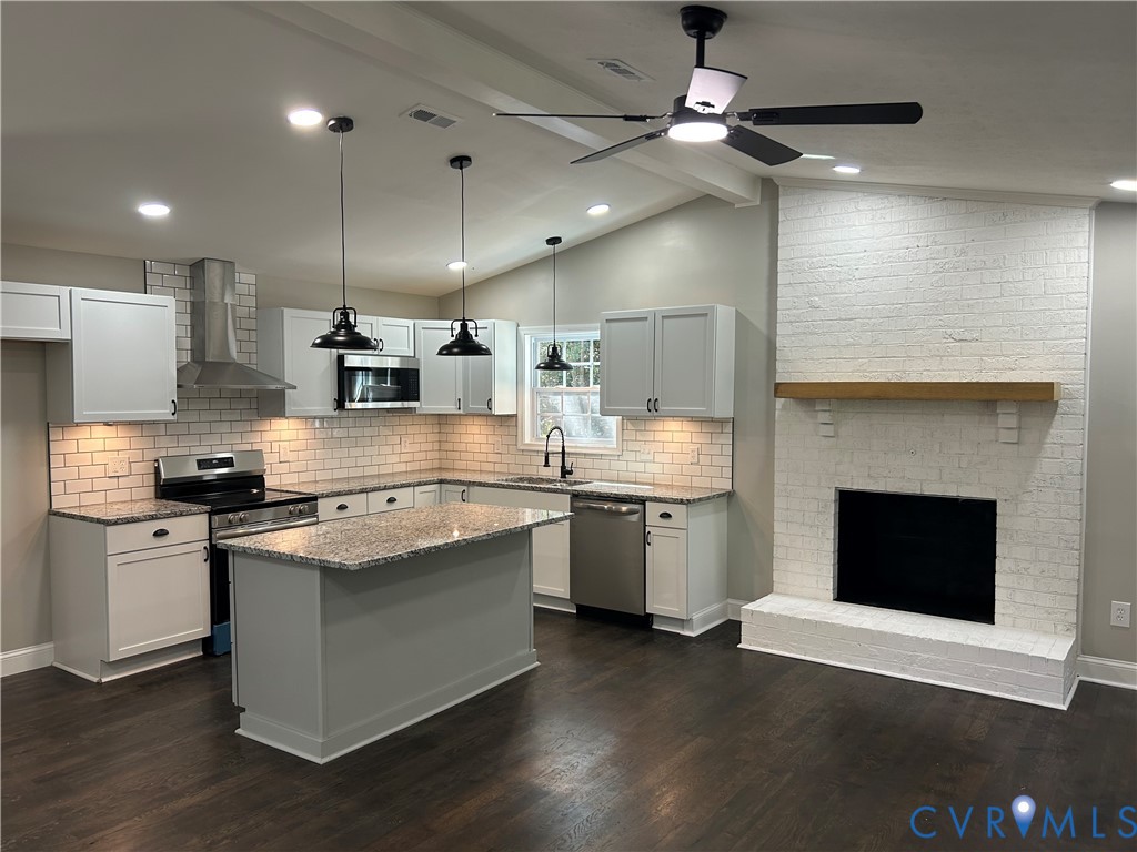 1024 Mill Road King William, VA 23086 - Photo 1 of 35 a large kitchen with stainless steel appliances kitchen island a large island in the center