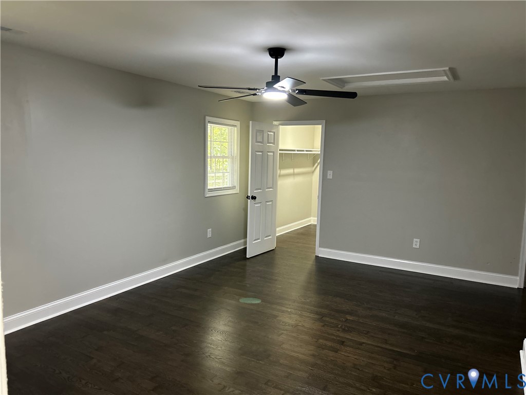 1024 Mill Road King William, VA 23086 - Photo 16 of 35 an empty room with wooden floor ceiling fan and windows