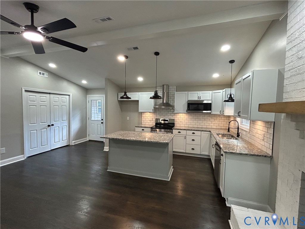 1024 Mill Road King William, VA 23086 - Photo 10 of 35 a large white kitchen with lots of counter space a sink appliances and cabinets