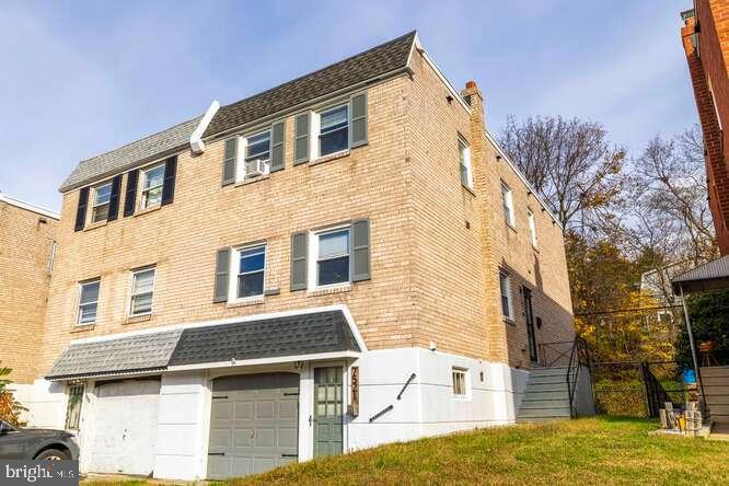 7521 Valley Avenue Philadelphia, PA 19128 - Photo 1 of 14 a front view of a house with a yard