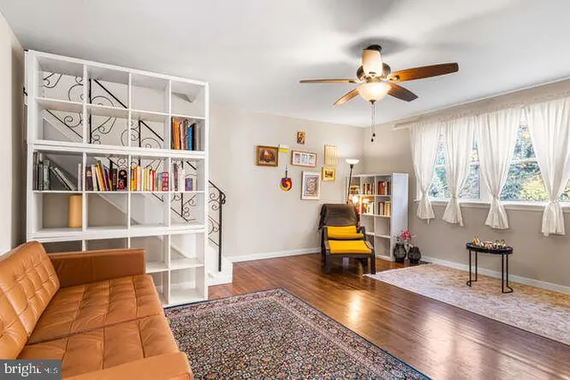 a living room with furniture and a lamp