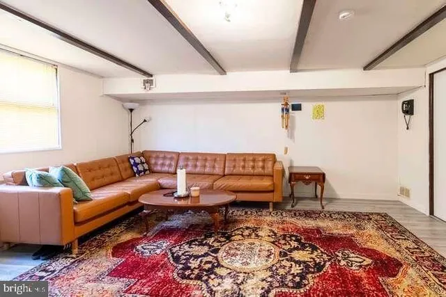 a living room with furniture and a rug