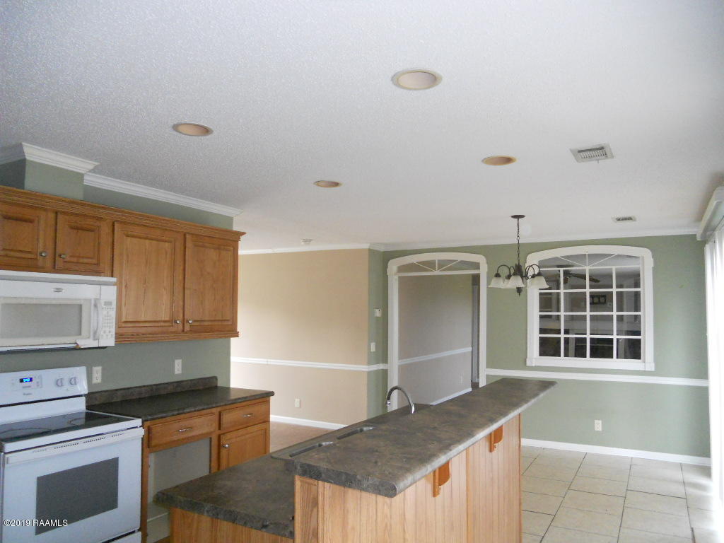 123 Blue Grass Road Washington, LA 70589 - Photo 6 of 20 kitchen looking to 2nd fam rm