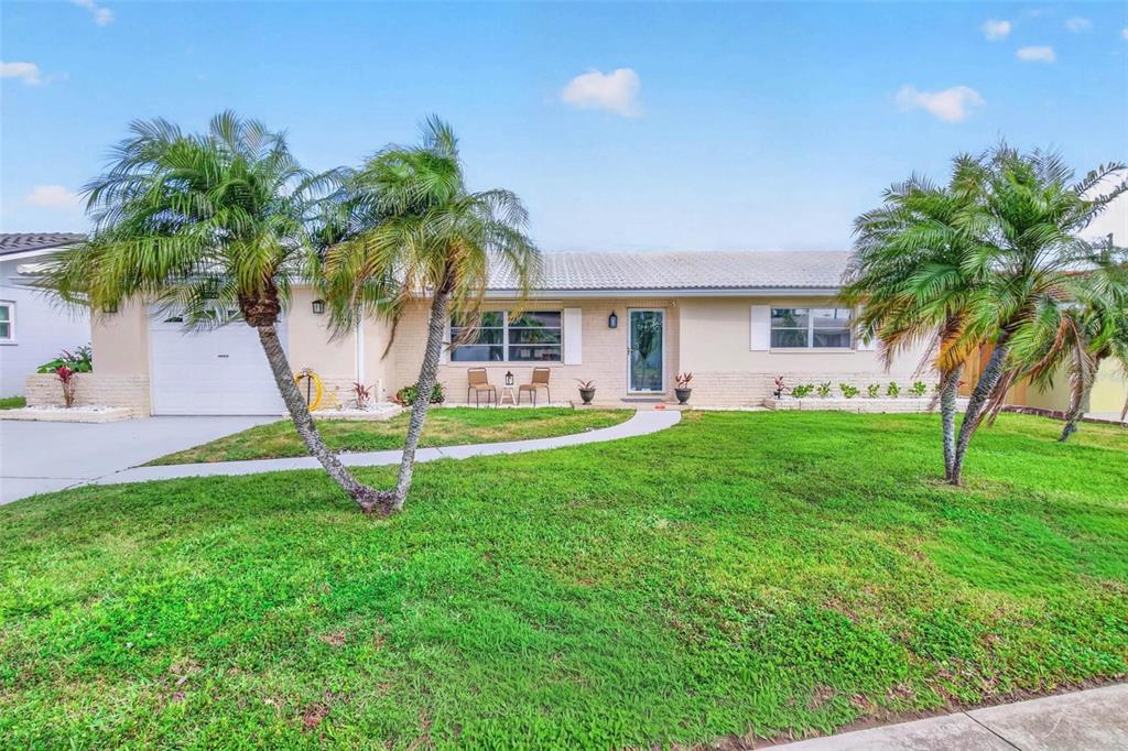 11225 59th Avenue Seminole, FL 33772 - Photo 1 of 15 a house view with a garden space