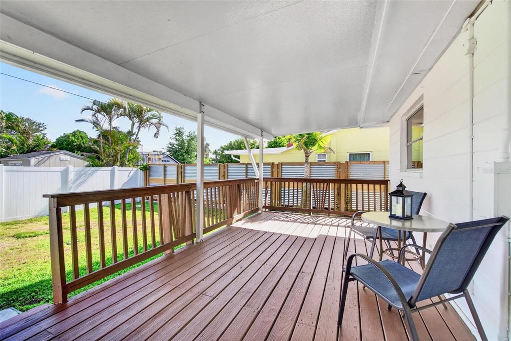 11225 59th Avenue Seminole, FL 33772 - Photo 11 of 15 a view of a chairs on wooden deck