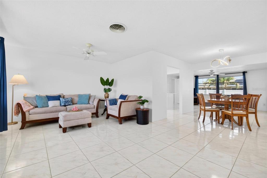 11225 59th Avenue Seminole, FL 33772 - Photo 2 of 15 a living room with furniture and a table